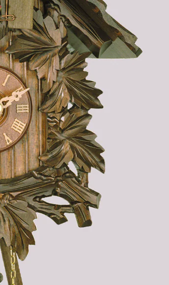 Cuckoo Clock with detailed carvings and pine cone wood weights