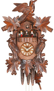 Original 1 Day Cuckoo Clock with music and dancers, a bird on top, surrounded by handcarved leaves and two birds on each side
