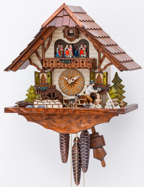 Original 8 Day Cuckoo Clock, Chalet Style with music and dancers, handcarved shingle roof, trees, a dog and a moving wind mill and the lumberjacks sawing wood