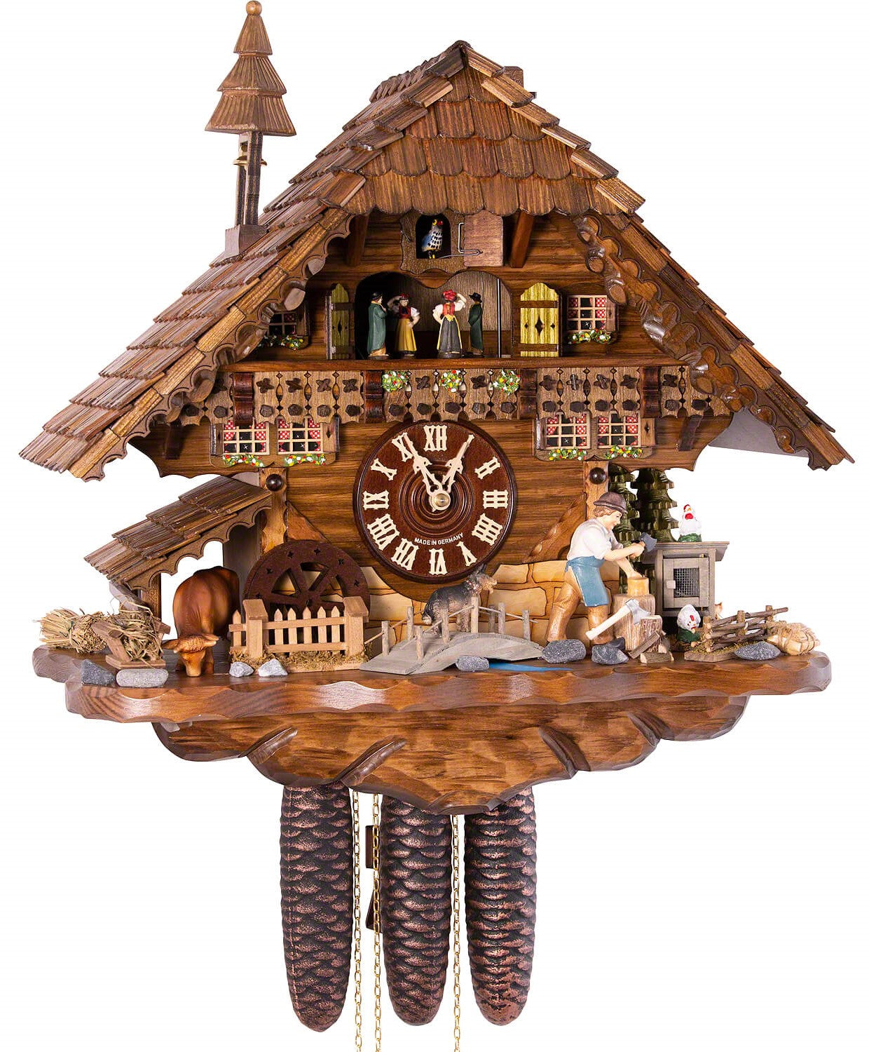 Original 8 Day Cuckoo Clock with music and dancers, Chalet Style, a watermill, a dog and a cow standing under a roof and the lumberjacks sawing wood