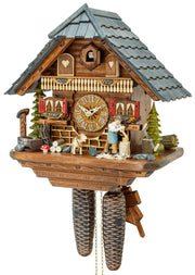 Original 8 Day Cuckoo Clock, Chalet Style, trees, a water fountain, a dog and a lumberjack sawing wood